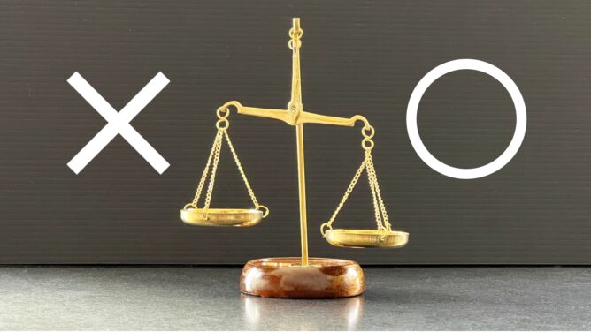 Gold balance scale with two pans; a white X on the left and a white circle on the right indicating wrong vs. correct.