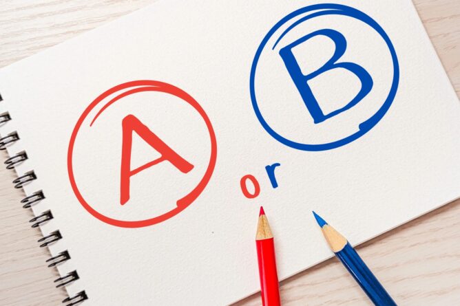 Notebook page showing a red A in a circle on the left and a blue B in a circle on the right, with the word 'or' between them and two pencils nearby, suggesting a choice between A or B.